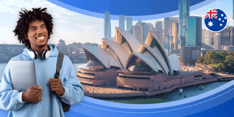 Student with laptop in front of the Sydney Opera House and Australian flag.