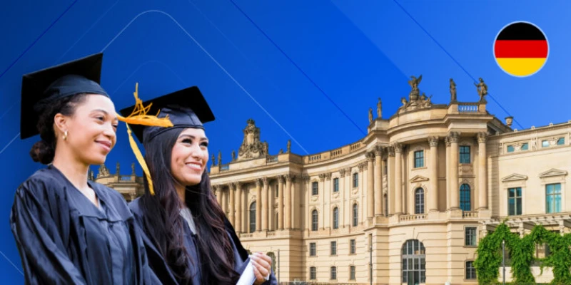 Two smiling international students in graduation gowns and caps standing in front of a historic German university building under a blue sky, featuring a circular German flag icon in the corner.