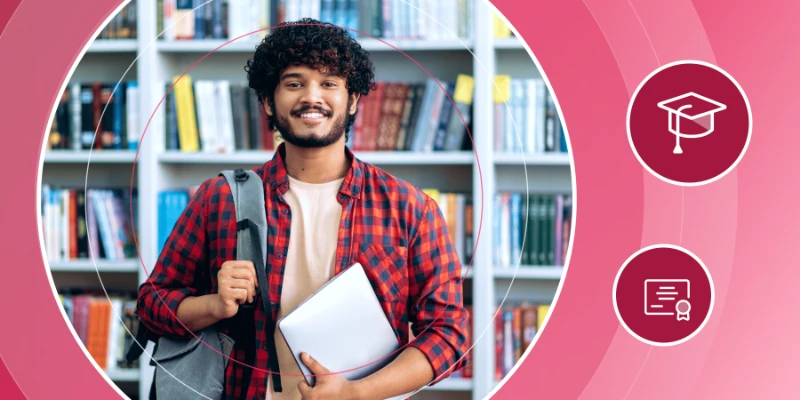 Smiling university graduate with a backpack and laptop in a library setting with academic icons.
