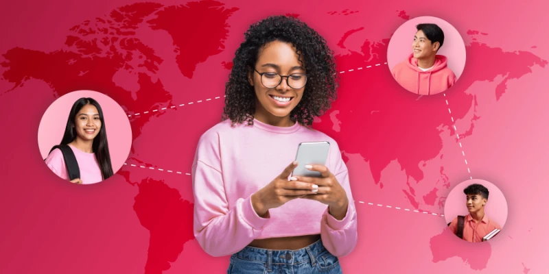 Smiling international student on phone against a pink world map connecting diverse peers applying to study in Spain.