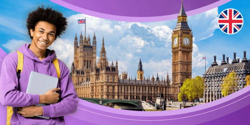Smiling international student holding a laptop in front of Big Ben and the Houses of Parliament, representing study in the UK.