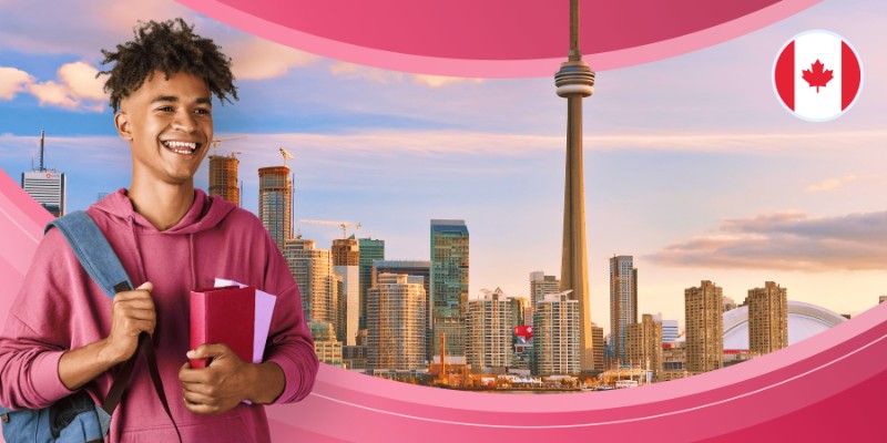 A smiling young male student in a pink hoodie holding notebooks and carrying a backpack, standing in front of the Toronto skyline with the CN Tower and a Canadian flag icon.